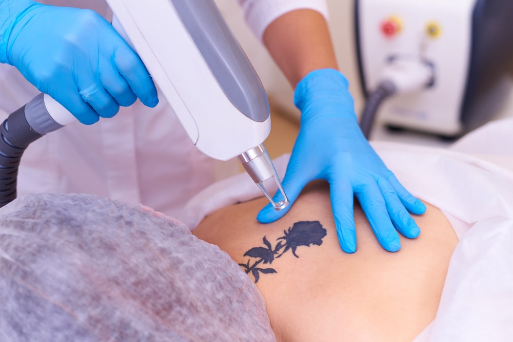 Dr. Arathy Jerald examining a patient's skin at Revive Skin and Cosmetology Clinic