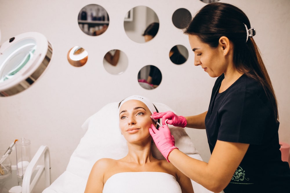 Dr. Arathy consulting with a patient at Revive Skin & Cosmetology Clinic